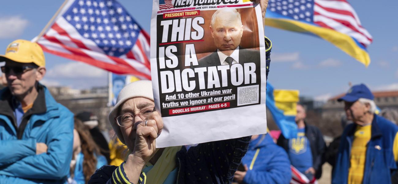 Demonstrators protest during a rally in support of Ukraine at The Ellipse near the White House in Washington, Saturday, March 8, 2025. (AP Photo/Jose Luis Magana)
