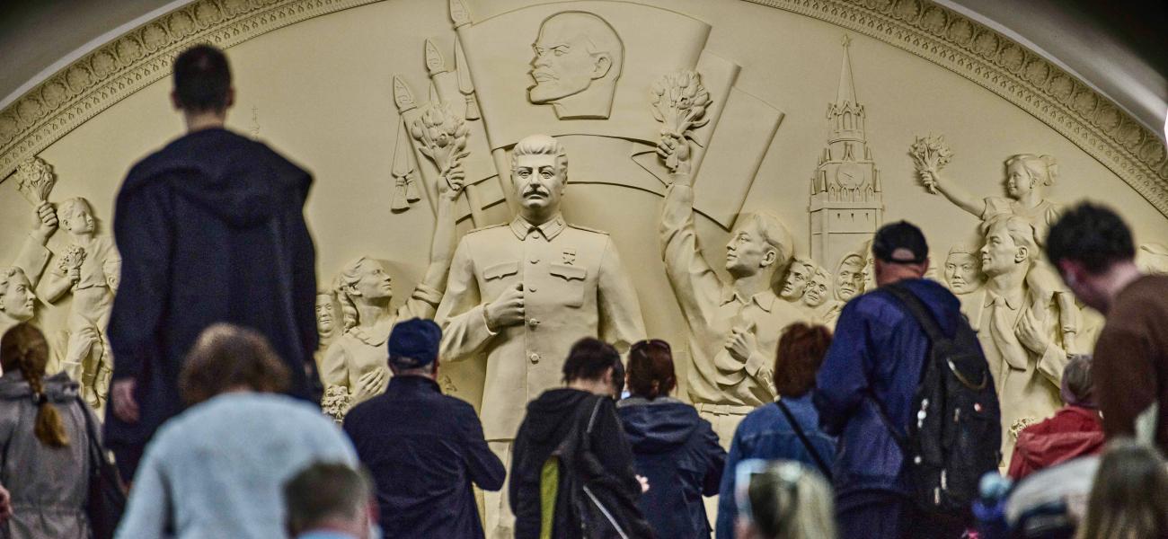 Passengers walk in front of a monument to Soviet leader Josef Stalin at the Taganskaya subway station in Moscow, Russia, on Wednesday, May 21, 2025. (AP Photo/Alexander Zemlianichenko, File)