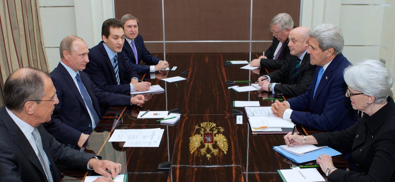 Russian President Vladimir Putin with then U.S. Secretary of State John Kerry. 