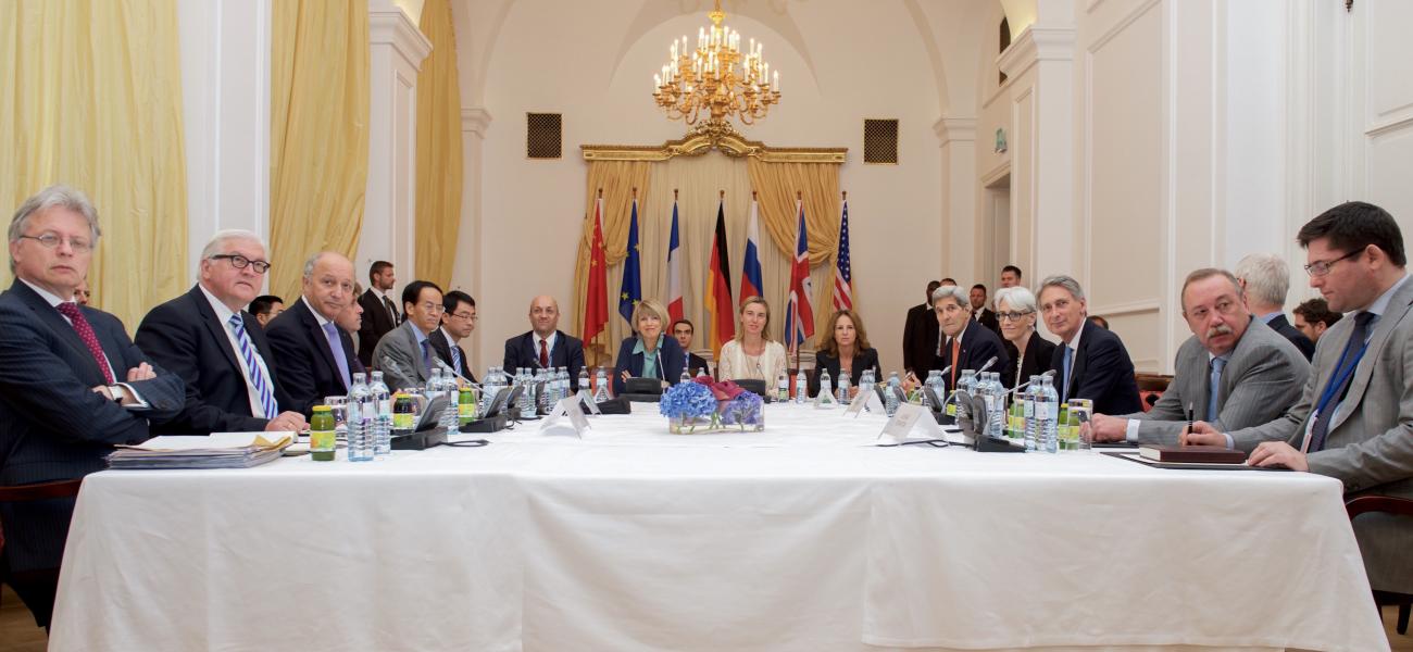 Wendy Sherman, fourth from right, sits next to then U.S. Secretary of State John Kerry during the P5+1 group session at the Iranian Nuclear Negotiations in Austria, July 9, 2015.