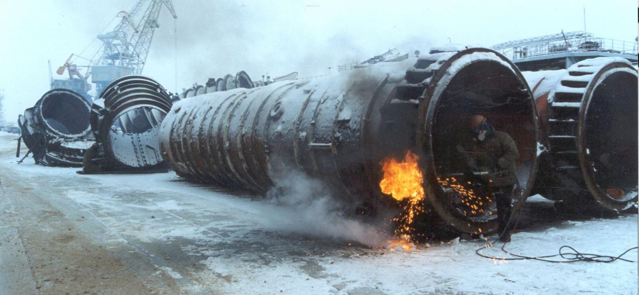 Worker dismantles ballistic submarine missile tubes.