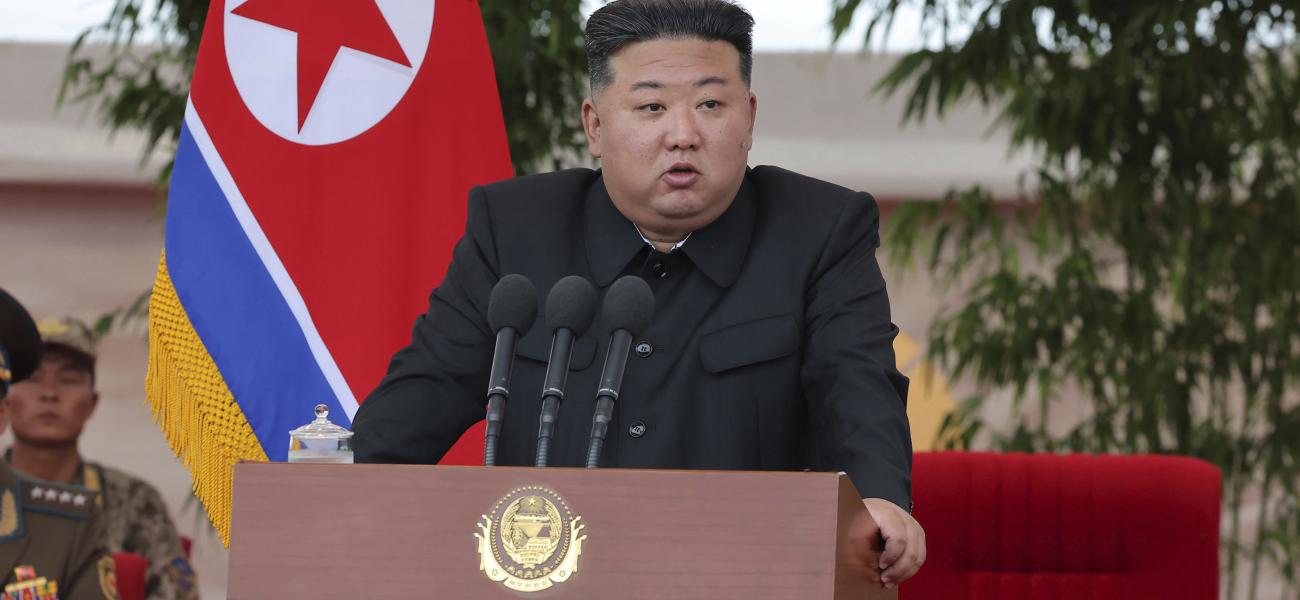orth Korean leader Kim Jong Un speaks as he visits an air force helicopter unit to praise the troops for helping rescue people from recent floods.