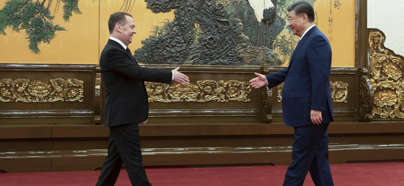 Russian Security Council Deputy Chairman and the head of the United Russia party Dmitry Medvedev, left, and Chinese President Xi Jinping shake hands during their meeting in Beijing Thursday, Dec. 12, 2024. (Ekaterina Shtukina, Sputnik Pool Photo via AP)