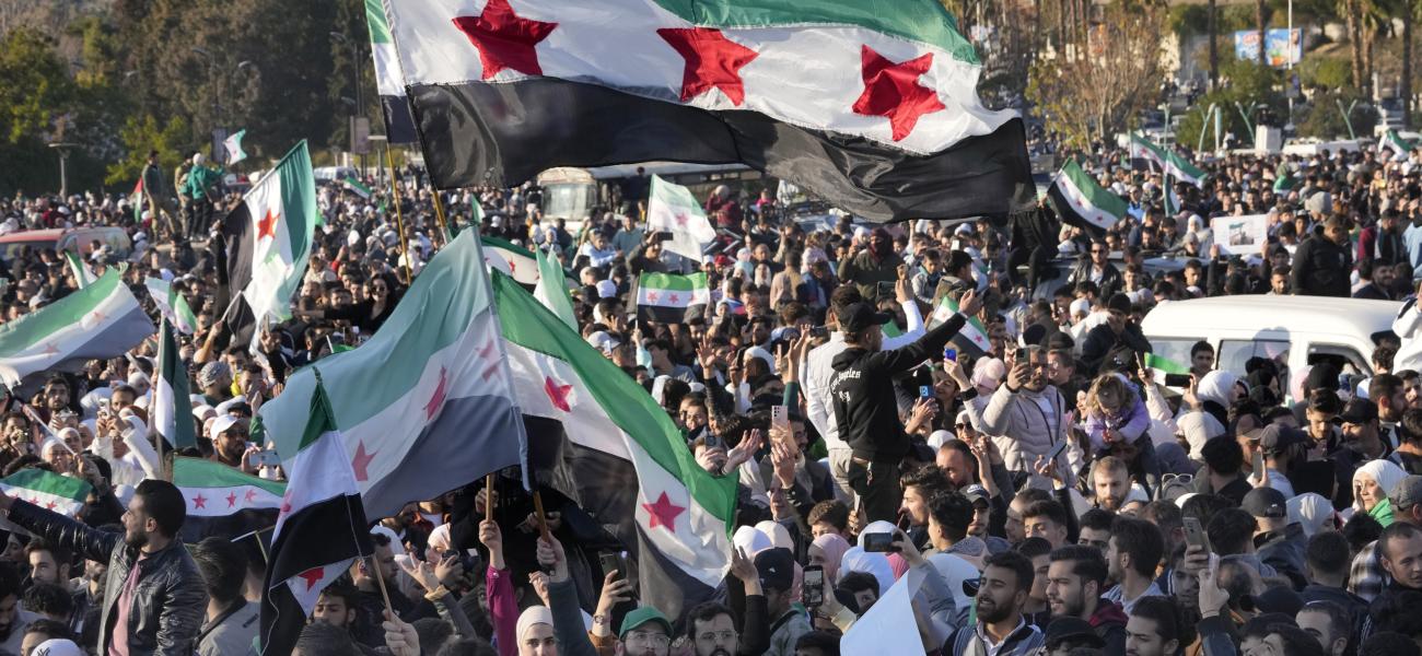 Syrians celebrate at the first Friday prayers since Bashar Assad's ouster at the central square in Damascus, Syria.