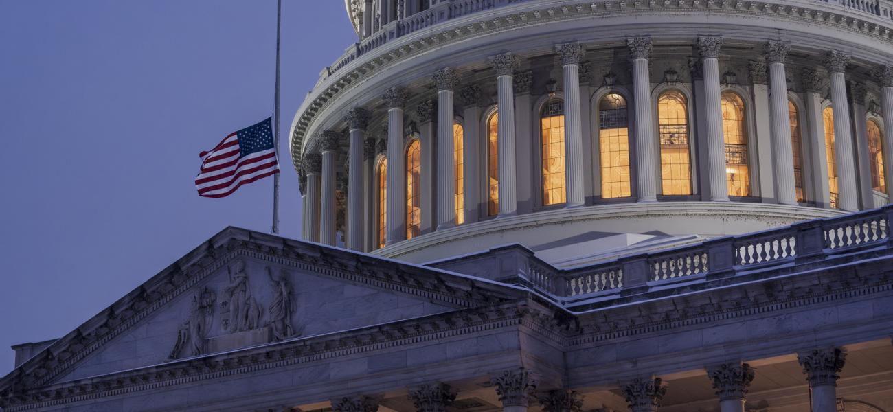 Capitol Hill is serene as snow continues to blanket the region, in Washington, Monday, Jan. 6, 2025. The flag flies at half-staff to honor former President Jimmy Carter who died last week at the age of 100. He will lie in state in the Rotunda. (AP Photo/J. Scott Applewhite)