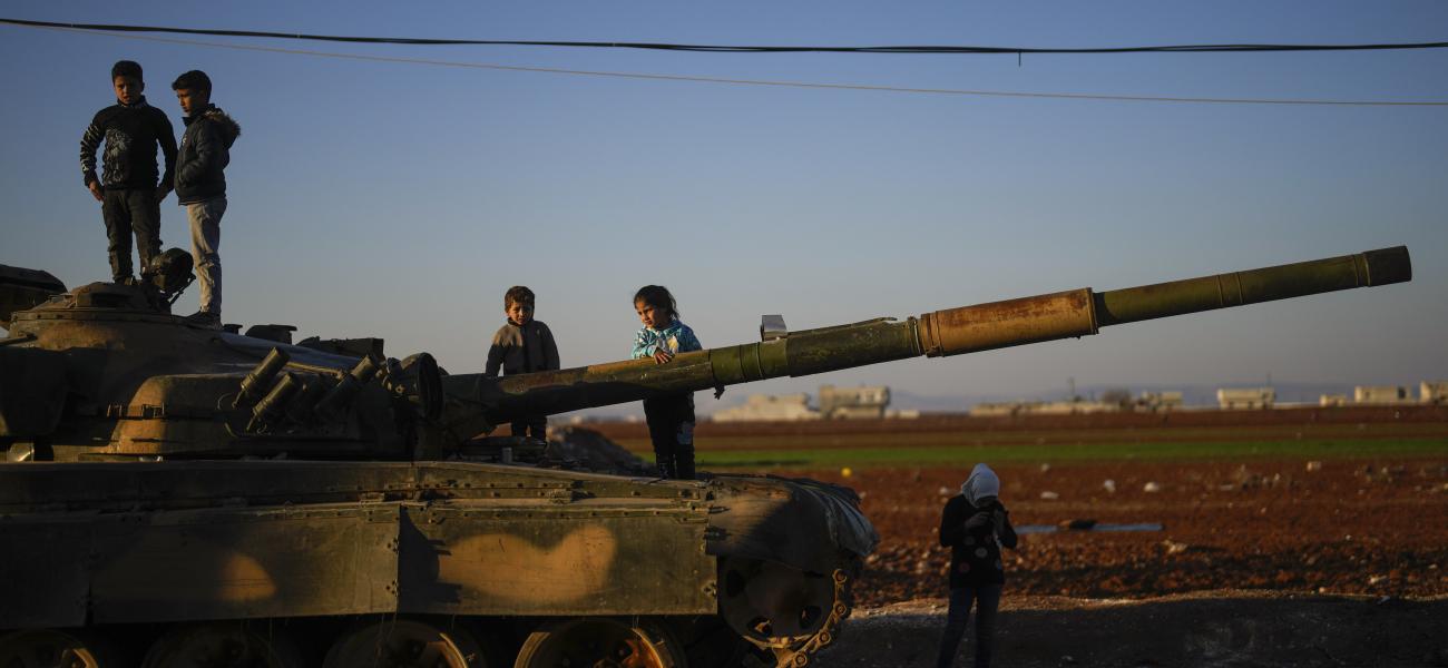 Children on the top of an ousted Syrian government forces tank that was left on a street in the town of Marea on the outskirts of Aleppo city, Syria, Tuesday, Jan. 28, 2025. (AP Photo/Khalil Hamra)
