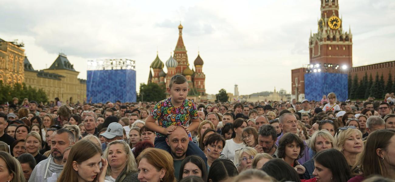People gather on Red Square to watch a concert dedicated to the upcoming Day of Russia in Moscow, Russia, Wednesday, June 11, 2025. (AP Photo/Pavel Bednyakov)