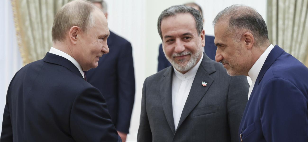 Russian President Vladimir Putin, left, greets Ambassador of Iran to Russia Kazem Jalali, right, and Iranian Foreign Minister Abbas Araghchi, center, prior to their talks at the Kremlin in Moscow, Russia, Monday, June 23, 2025. (Alexander Kazakov, Sputnik, Kremlin Pool Photo via AP)