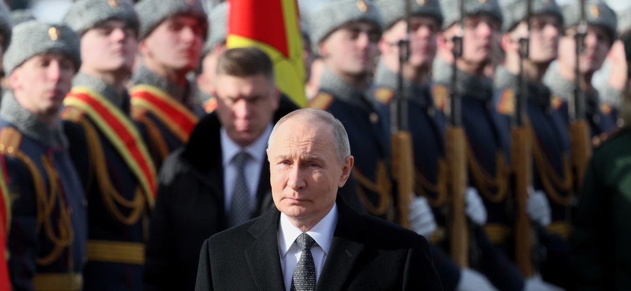 Russian President Vladimir Putin attends a wreath-laying ceremony at the Tomb of the Unknown Soldier, near the Kremlin Wall during the national celebrations of the "Defender of the Fatherland Day" in Moscow, Russia, Monday, Feb. 23, 2026. (Maxim Shipenkov/Pool Photo via AP)