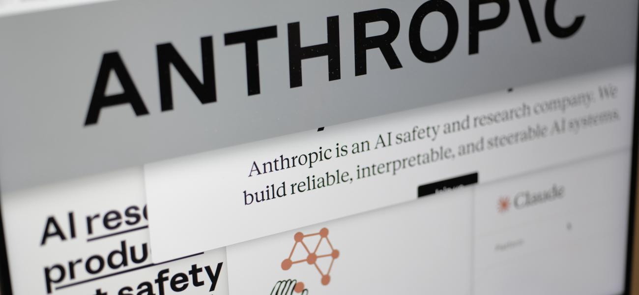 Pages from the Anthropic website and the company's logo are displayed on a computer screen in New York on Feb. 26, 2026. (AP Photo/Patrick Sison, File)