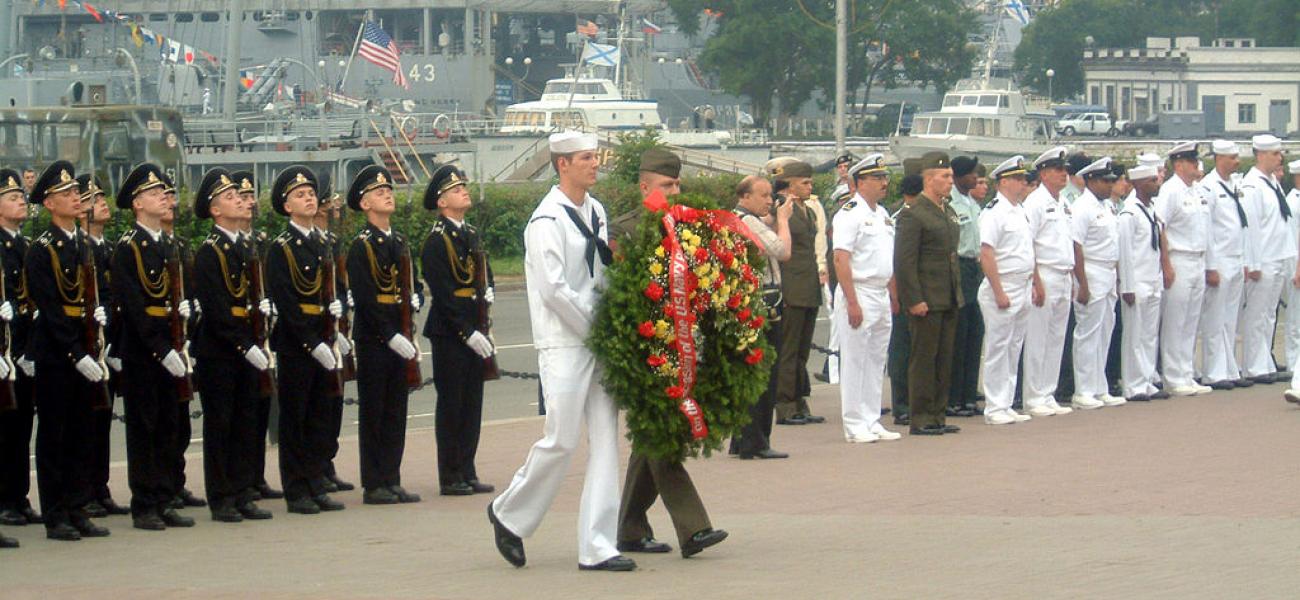 Russian and U.S. sailors honoring military personnel who perished during World War II, Vladivostok, Russia, July 4, 2002