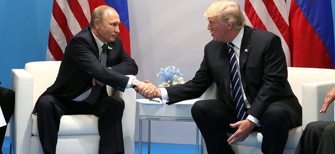 Trump and Putin shaking hands