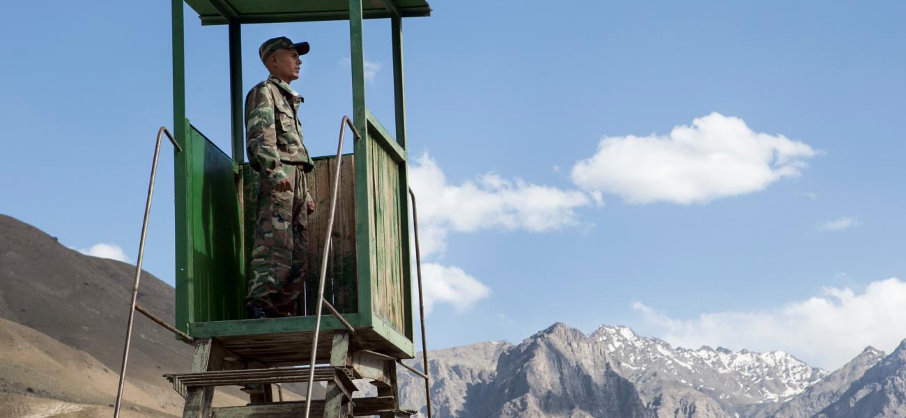 A Tajik conscript looks out over remote stretches of northern Afghanistan from a border outpost near Khorog, Tajikistan.