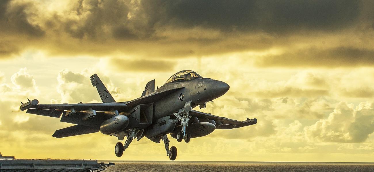 Fighter plane takes off from an aircraft carrier.