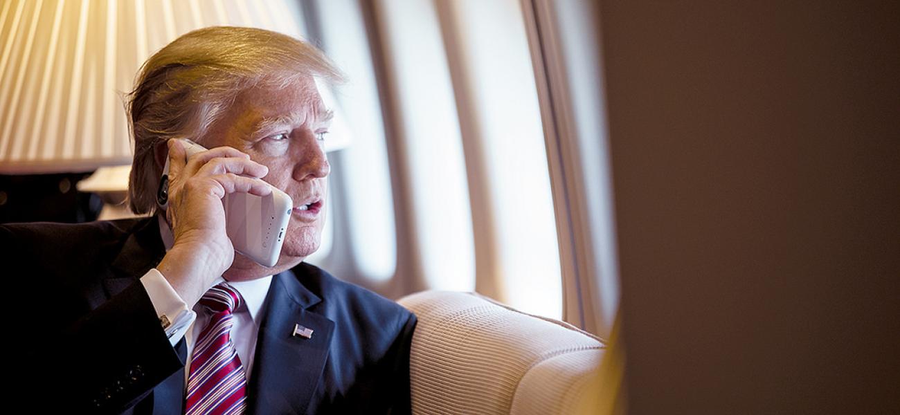U.S. President Donald Trump talking on a cell phone.