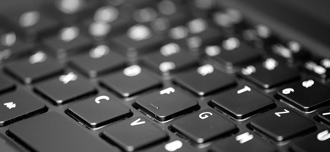 Close up of black and white computer keyboard.