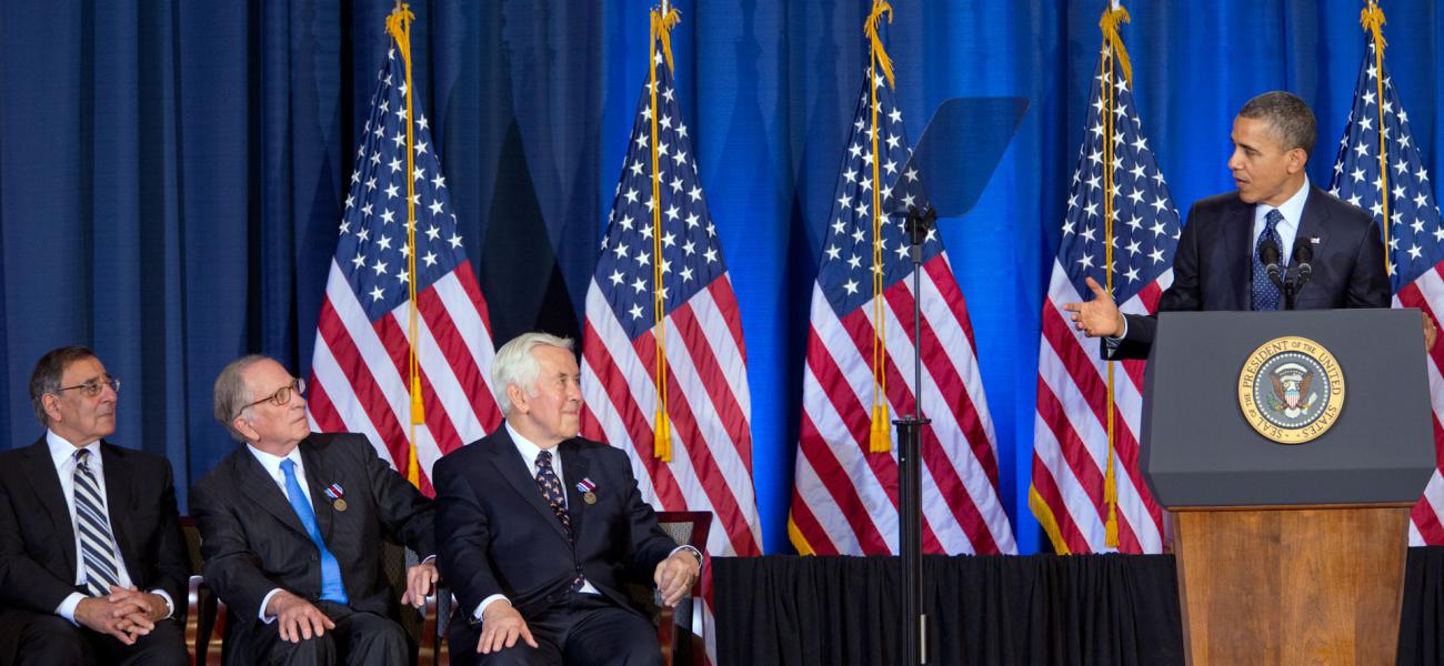 Former Sen. Sam Nunn, second from left, listens to then-President Barack Obama deliver remarks to the Nunn-Lugar Cooperative Threat Reduction symposium, Dec. 3, 2012.