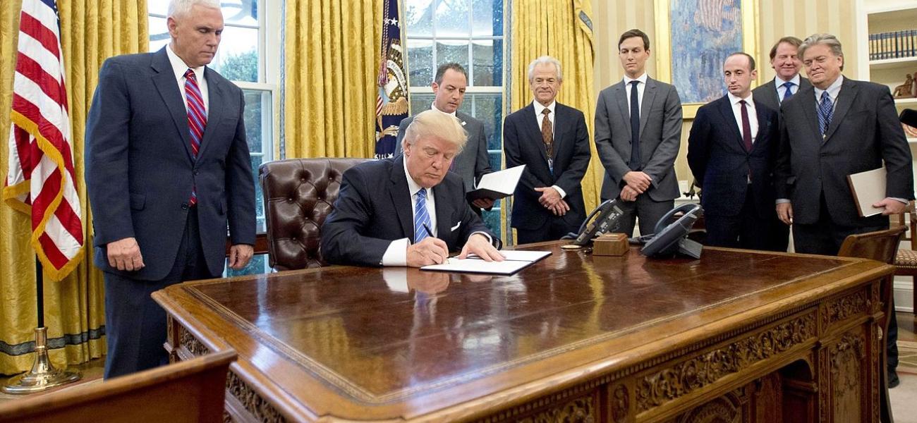 U.S. President Donald Trump signing an executive order in the White House.