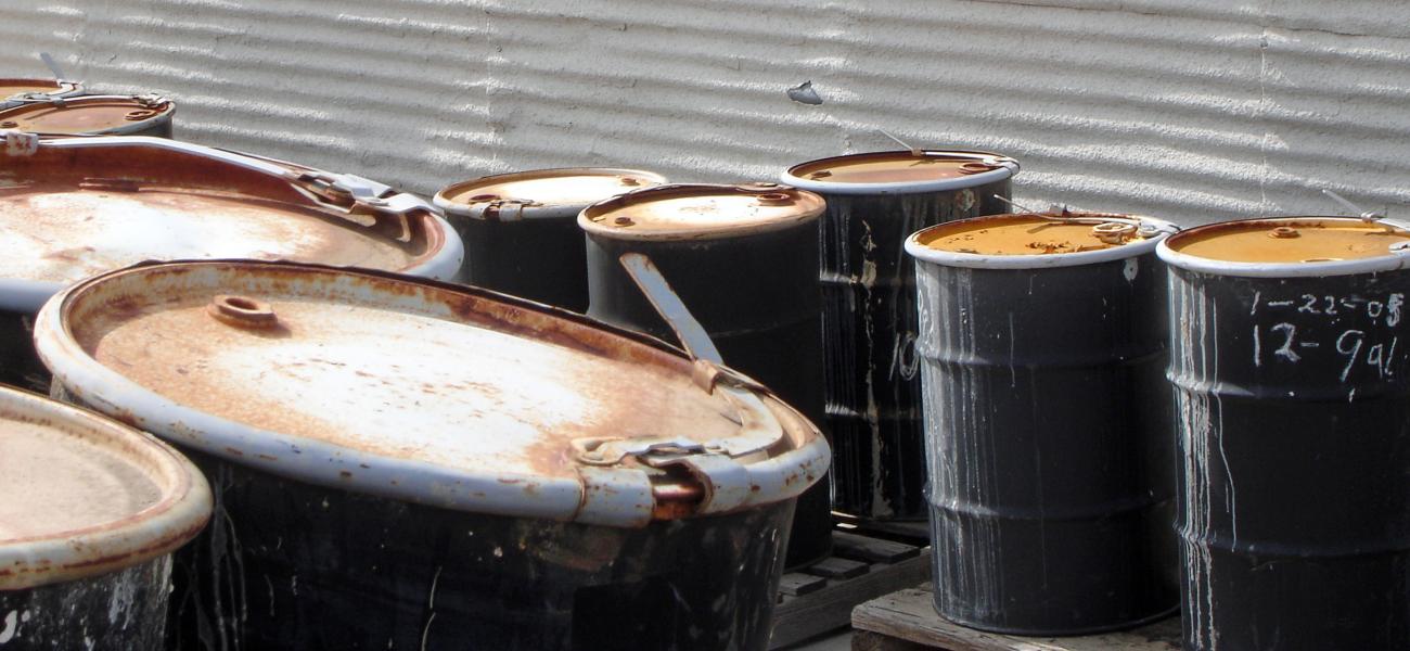 Oil drums heaped together.