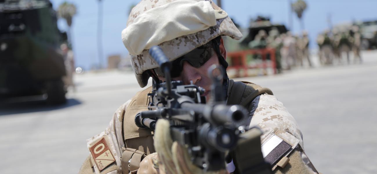 A marine aiming at mock enemies.