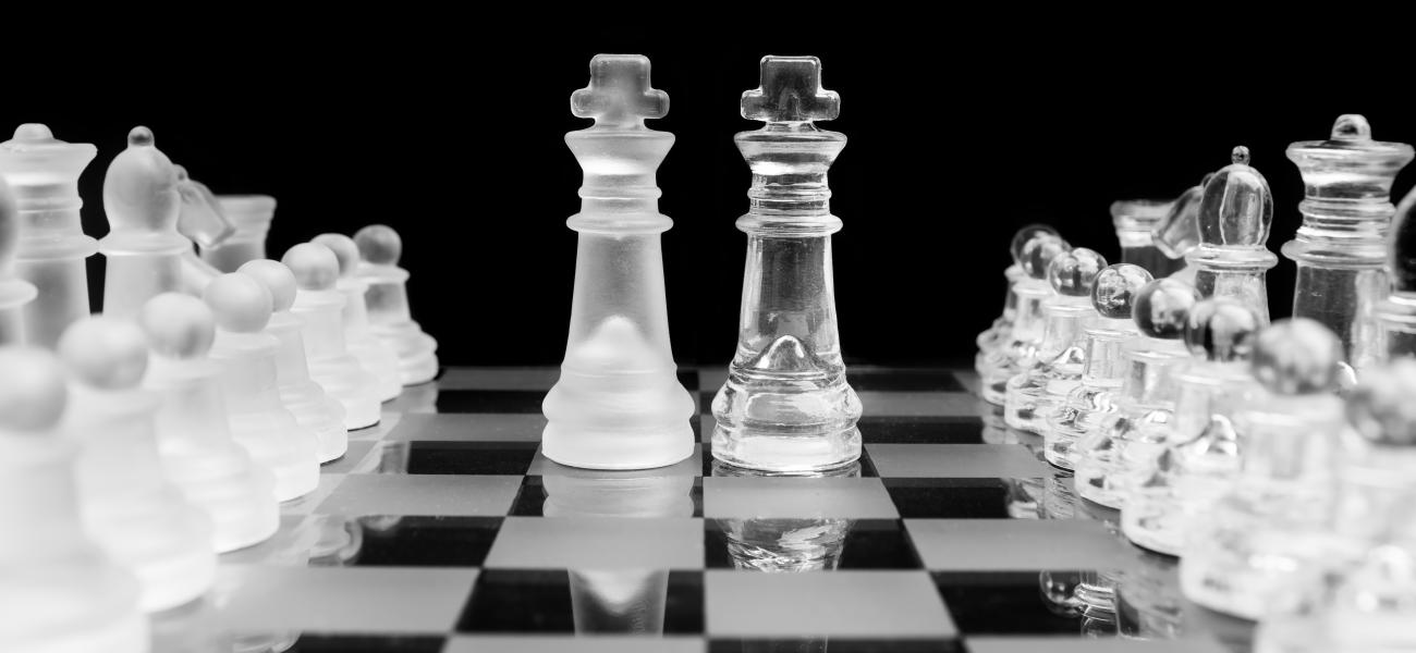 Symbolizing Russia and the U.S., chess pieces face each other on the chessboard.