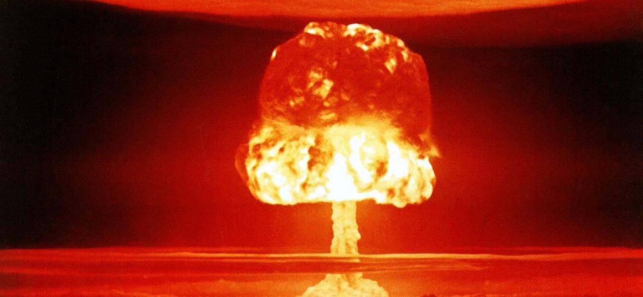 Image of an atomic blast in reds and oranges.