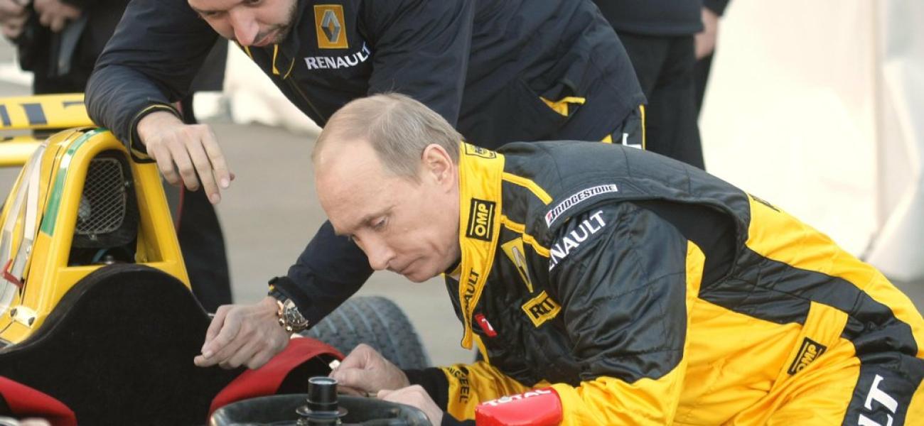 Russian President Putin examines a racecar