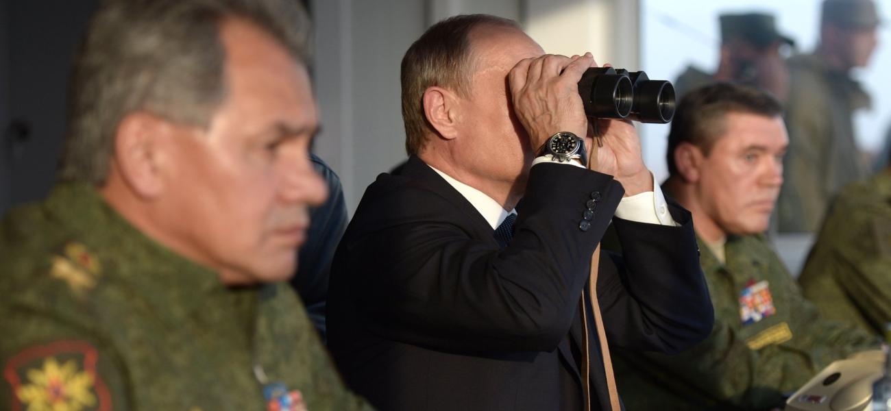 Putin watching military exercises through binoculars, 2015