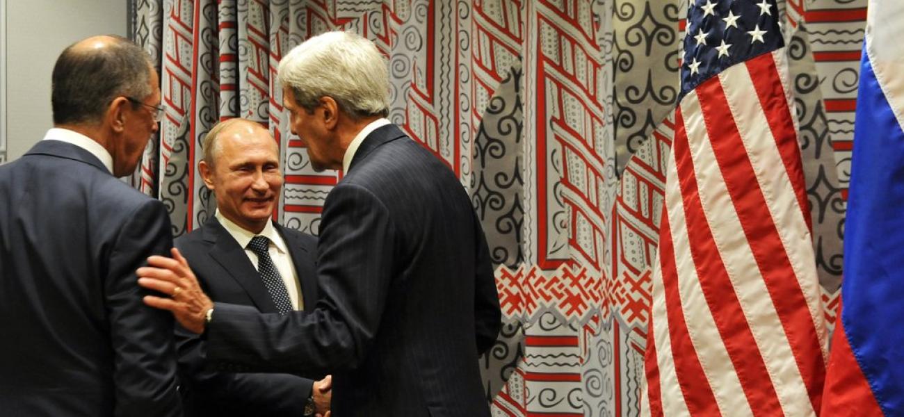 Russian President Vladimir Putin meets former Secretary of State John Kerry after meeting with former U.S. President Barrack Obama.