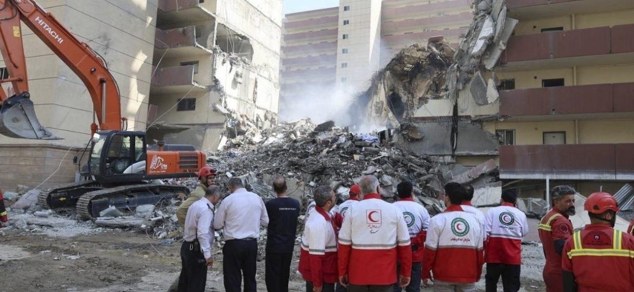 In this photo released by the Iranian Red Crescent Society rescuers work at the scene of an explosion after an Israeli strike in Tehran, Iran, Friday, June 13, 2025. (Iranian Red Crescent Society via AP)