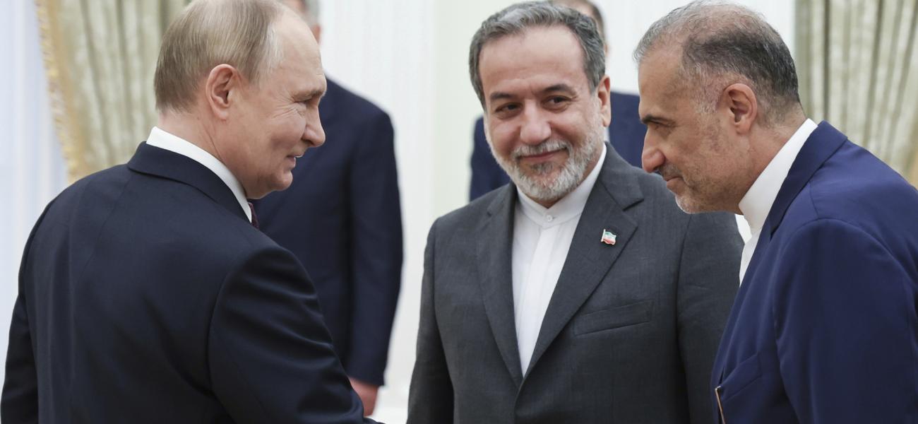 Russian President Vladimir Putin, left, greets Ambassador of Iran to Russia Kazem Jalali, right, and Iranian Foreign Minister Abbas Araghchi, center, prior to their talks at the Kremlin in Moscow, Russia, Monday, June 23, 2025. (Alexander Kazakov, Sputnik, Kremlin Pool Photo via AP)
