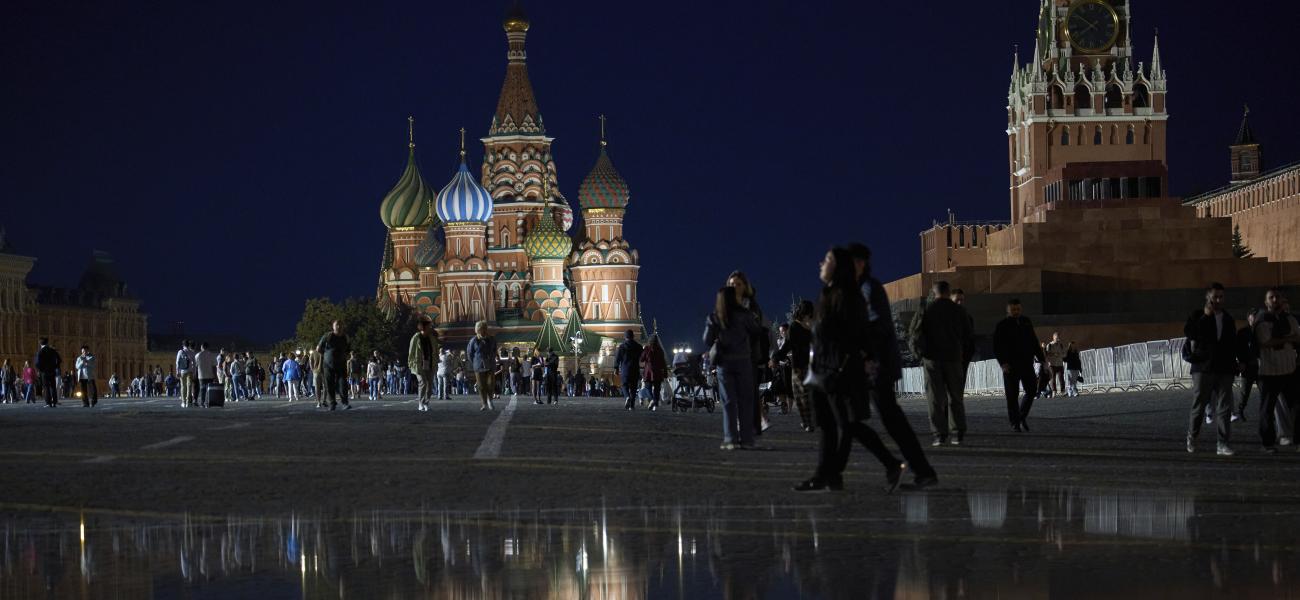 People enjoy a warm evening walking on Red Square in Moscow, Russia, Wednesday, Sept. 10, 2025, with the St. Basil's Cathedral and the Spasskaya Tower in the background. (AP Photo/Alexander Zemlianichenko)
